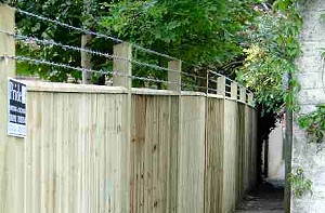 Closeboard Fencing with Barbed Wire